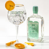 Brighton Gin Pavilion Strength Gin & Tonic served in a copa glass with ice and a slice of orange